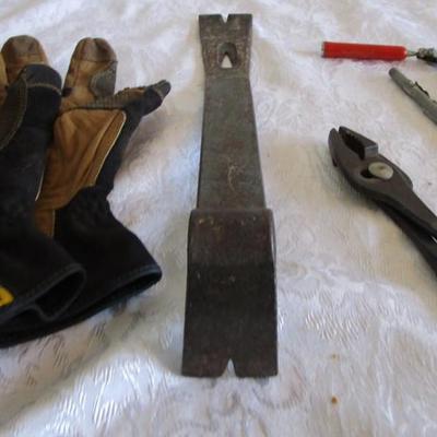 Pry bar, magnets, leather gloves, pliers