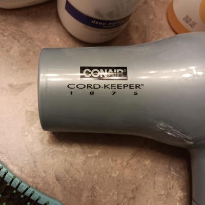 SHOWER CADDY, CLEANERS AND HAIR DRYER