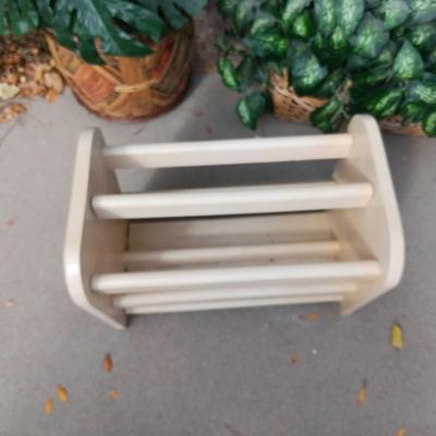 2 FAUX PLANTS AND A MAGAZINE RACK