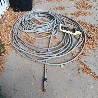 LONG GARDEN HOSE AND SPRINKLERS