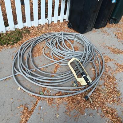 LONG GARDEN HOSE AND SPRINKLERS