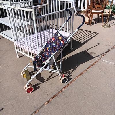 CHANGING TABLE, FOLDING PORTABLE CRIB, TOTE FULL OF BABY BLANKETS AND A STROLLER