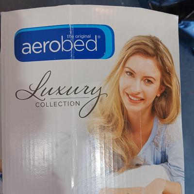 TWIN SIZE AEROBED AIR MATTRESS AND A NEW THROW BLANKET