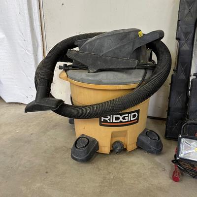 RIGID SHOP VACUUM, HUSKY WORK LIGHT, SAW HORSES, AND HEAVY DUTY 100’ EXTENSION CORD