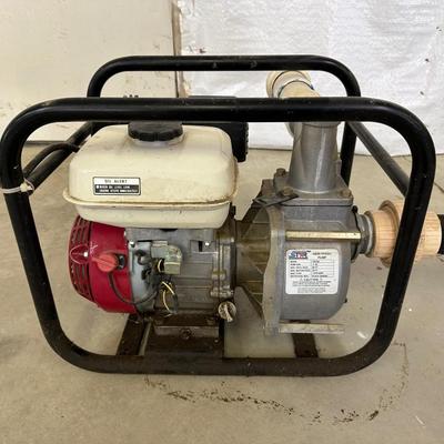NORTH STAR 2” SEMI-TRASH WATER PUMP OPERATED BY A GAS 4HP HONDA MOTOR