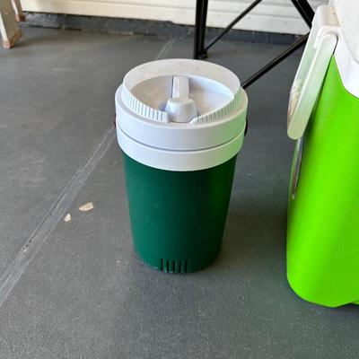 2 FOLDING CHAIRS, 2 BEVERAGE COOLERS AND A FOOD COOLER
