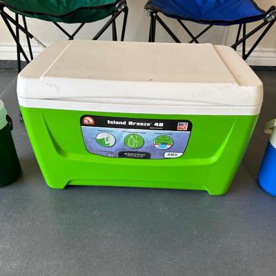 2 FOLDING CHAIRS, 2 BEVERAGE COOLERS AND A FOOD COOLER
