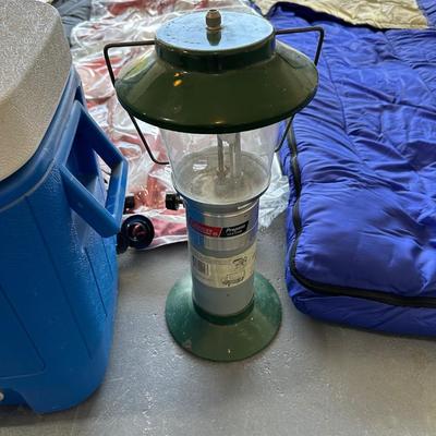 2 SLEEPING BAGS, TWIN INFLATABLE MATTRESS, COLEMAN LANTERN AND COOLER