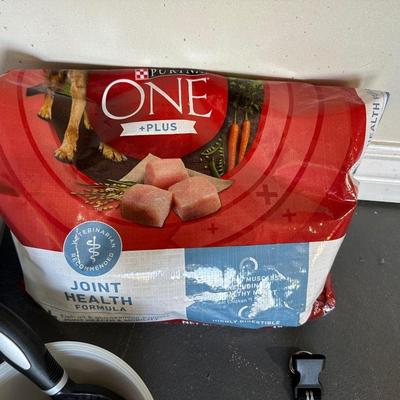 SOFT DOG BED, PARTIAL BAG OF DOG FOOD, FOOD STORAGE CONTAINER, GROOMING ITEMS AND MORE