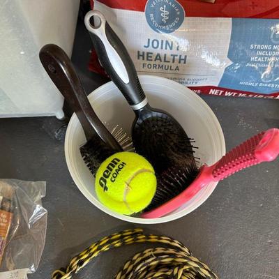 SOFT DOG BED, PARTIAL BAG OF DOG FOOD, FOOD STORAGE CONTAINER, GROOMING ITEMS AND MORE