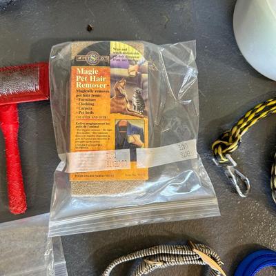 SOFT DOG BED, PARTIAL BAG OF DOG FOOD, FOOD STORAGE CONTAINER, GROOMING ITEMS AND MORE