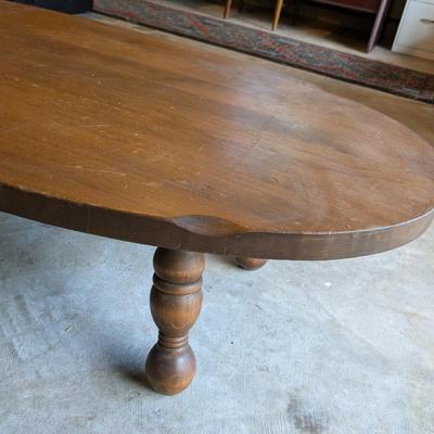 solid wood coffee table with 4 legs value: $150 lot 7833031