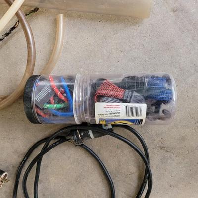 Lot of smalls, jumper cables, bungee cords , extensions cords