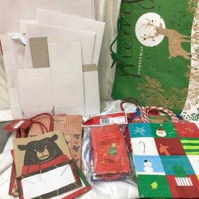Christmas Themed Gift Bags and White Present Boxes.