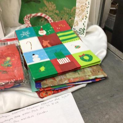 Christmas Themed Gift Bags and White Present Boxes.