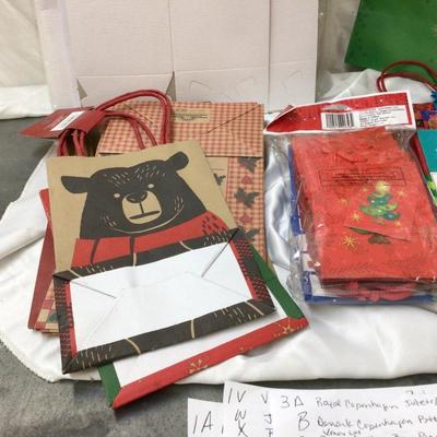 Christmas Themed Gift Bags and White Present Boxes.
