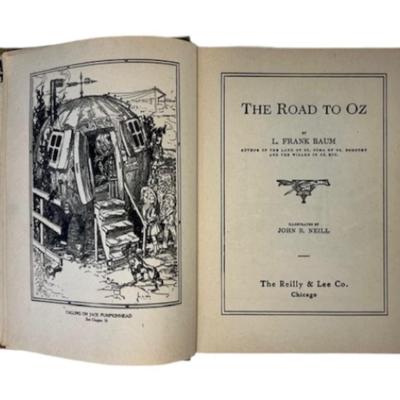 Sale Photo Thumbnail #636: Pre-auction estimate: $250-500. By Frank Baum. Illustrated by John R. Neill. Early printing published by Reilly & Lee. 266 pages. There are 12 color plates throughout the book. There is age related wear. The spine is intact. Measurement: 7" x 9.25". [BS]