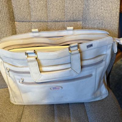 Briefcase full of paper