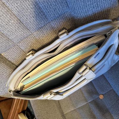 Briefcase full of paper