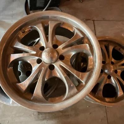 Two Custom chrome rims used on an impala plus one