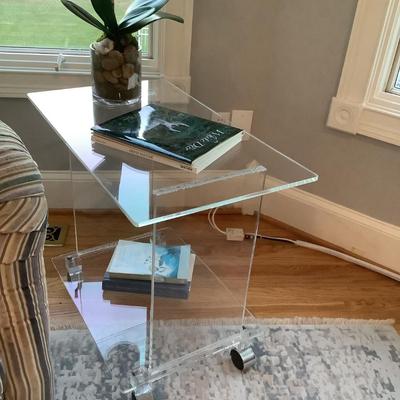 Lucite 2 tier side table on casters 24"H 27"L 16"W