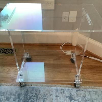 Lucite 2 tier side table on casters 24"H 27"L 16"W