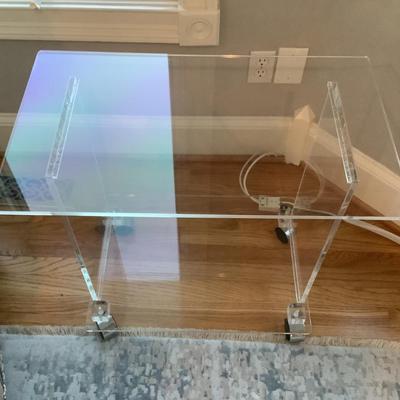 Lucite 2 tier side table on casters 24"H 27"L 16"W