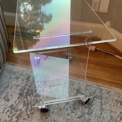 Lucite 2 tier side table on casters 24"H 27"L 16"W
