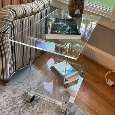 Lucite 2 tier side table on casters 24"H 27"L 16"W