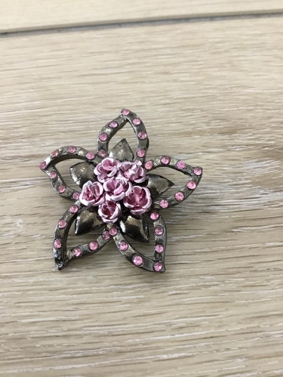 1980s pink resin brooch with floral print