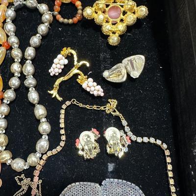 Sale Photo Thumbnail #247: Czech necklace, coral grape pin, Miriam Haskel style baroque faux pearls with rhinestone rondelles, fruit basket pin. Agate necklace, vintage shoe clips & so much more - what a great lot.!!! 
Everything except the tray is included