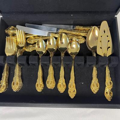 Sale Photo Thumbnail #960: Gold tone. Includes an eight-place setting plus serving pieces. Also includes box. [LA]