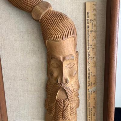 Wood carving of a man
