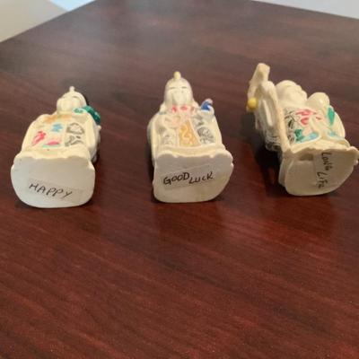 3 Asian figures representing Happy, Good Luck, and Long Life, box