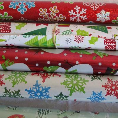 5 rolls Christmas wrapping paper, 2 new in pkg, 3 partially used