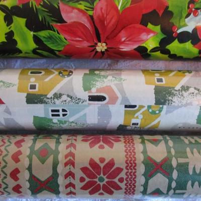 5 rolls Christmas wrapping paper, 2 new in pkg, 3 partially used