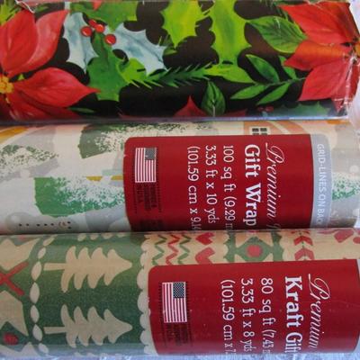 5 rolls Christmas wrapping paper, 2 new in pkg, 3 partially used