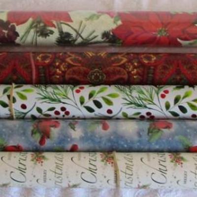 5 rolls Christmas wrapping paper, 2 new in pkg, 3 partially used