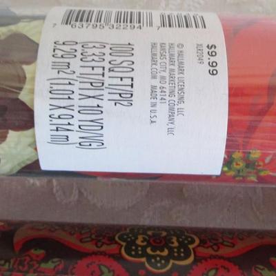 5 rolls Christmas wrapping paper, 2 new in pkg, 3 partially used