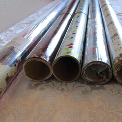 5 rolls Christmas wrapping paper, 2 new in pkg, 3 partially used
