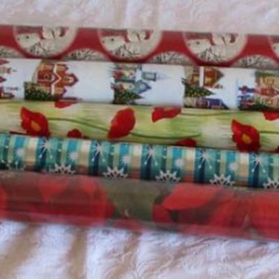 5 rolls Christmas wrapping paper, 2 new in pkg, 3 partially used