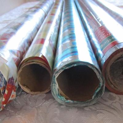 5 rolls Christmas wrapping paper, 2 new in pkg, 3 partially used