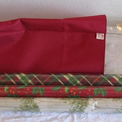 3 new rolls of Christmas wrapping paper, 1 Zippered storage bag for gift wrap