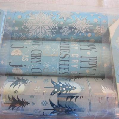 Set of 3 rolls Christmas gift wrap, 6 bows, and gift tags