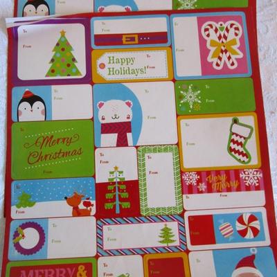 19 folded Christmas gift wrap sheets, 1 pkg Christmas tissue paper, 2 white gift boxes