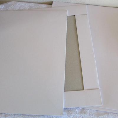 19 folded Christmas gift wrap sheets, 1 pkg Christmas tissue paper, 2 white gift boxes