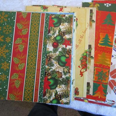 19 folded Christmas gift wrap sheets, 1 pkg Christmas tissue paper, 2 white gift boxes