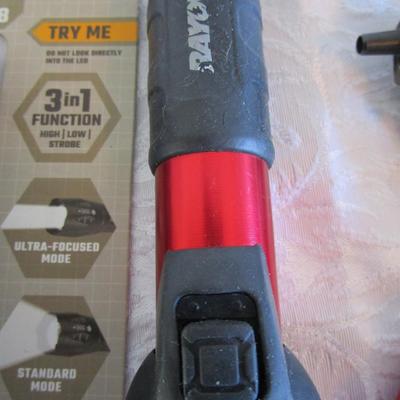 1 new in pkg Quantum flashlight, 1 Rayovac flashlight, 1 phillipis screwdriver, 2 small sets of sockets, 1 rivet tool, 1 small lock with...