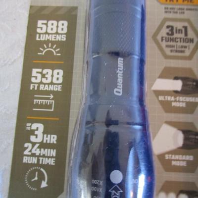 1 new in pkg Quantum flashlight, 1 Rayovac flashlight, 1 phillipis screwdriver, 2 small sets of sockets, 1 rivet tool, 1 small lock with...