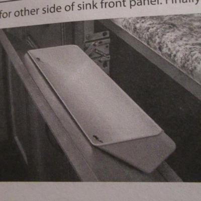 Rev-A- Shelf molded sink tip-out trays with hinges